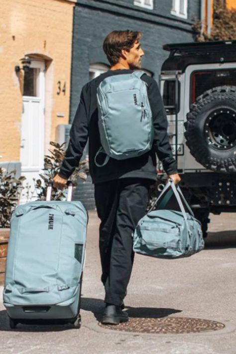 Man in his 30s carrying an all-in-one duffel rucksack, pulling a travel bag, and walking towards a Land Rover, ready for his next adventure in the great outdoors. Perfect travel aesthetic for men who love practical and stylish gear. Duffel Bag Aesthetic, Travel Aesthetic Outfits, Travel Life Hacks, Gear Organizer, Aesthetic Travel, Camping Outfits, Aesthetic Outfit, Travel Life, Adventure Awaits