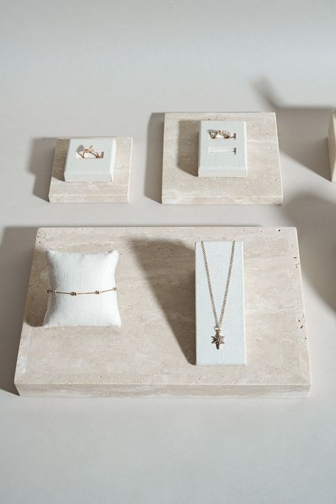 Linen display props and travertine blocks : a dream display duo #jewellerydisplay #displayprop #displayblock Rosary Display, Fine Jewelry Display, Jewellery Displays, Jewelry Shop Display, Charm Bar, Display Props, Versatile Jewelry, Decor Display, Shop Display