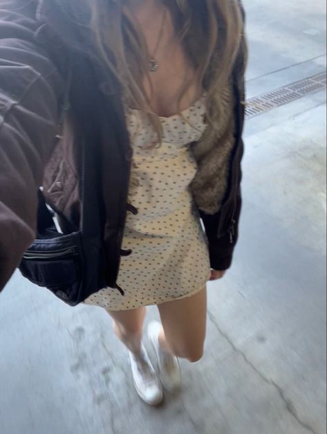 woman with brown hair walking taking a selfie wearing a short white brandy melville dress with blue flowers and a black purse and white converse Brandy Melville Arianna Dress, Brandy Melville Robbie Dress, Brandy Dress Outfits, Brandy Melville Dress Outfit, Amara Dress Brandy Melville, Brandy Dress, Brandy Melville Dress, Downtown Outfits, Dress Aesthetic