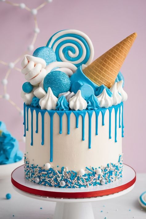 Fun Blue Drip Cake with Ice Cream Cone and Candy Decorations Sweet Drip Cake, Kids Birthday Cake Design, Ice Cream Cake Decorating Ideas, Birthday Cake Aesthetic Blue, Ombre Blue Cake, Marshmallow Birthday Cake, 11 Birthday Cake, Birthday Cake Nyc, Blue Drip Cake