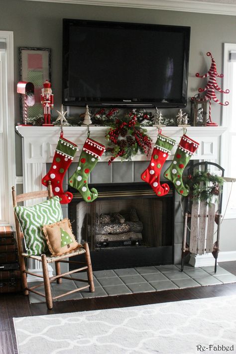 One of the biggest challenges in home decorating is how to decorate your mantel with a TV. This post highlights several different ideas on how to do just that! Must pin to remember this one. How To Decorate Mantle With Tv Above It For Christmas, Christmas Mantle Decor With Tv, Decorating Mantles, Christmas Fireplace Design, Decorating A Mantel, Diy Christmas Fireplace, Christmas Mantles, Fireplace Mantles, Christmas Decs