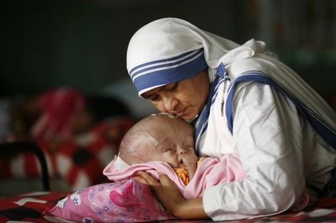 BANGLADESH/Sister Angelita, of Missionaries of Charity, holds 4-month old Michael who has hydrocephalus, a condition with excessive accumulation of fluid in the brain, at an orphanage in Old Dhaka, Bangladesh, November 18, 2009. REUTERS/Andrew Biraj Old Dhaka, Missionaries Of Charity, 4 Month Old Baby, Bride Of Christ, Dhaka Bangladesh, 4 Month Olds, Roman Catholic Church, Latest News Today, Women Of Faith