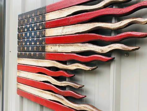 "Add some rustic charm to your home decor with this tattered American battle flag. The American battle flag sign has tattered ends to represent old glory standing proud and true after the smoke of a valiant battle has cleared. Available in three sizes. 24\", 36\", and 48\". The finish of this wooden American battle flag is age distressed to lend an old and weathered appearance. You will swear that it is an antique piece of art. The backside of this American flag sign is stained in Ebony and has American Flag Diy, Tattered American Flag, Old American Flag, American Flag Photos, Flag Diy, American Flag Art, Rustic American Flag, Battle Flag, 4th July Crafts