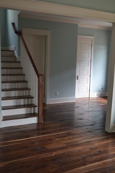 i love the brown floors and pale blue walls Slate Blue Walls, Beams Fireplace, Dark Brown Floor, Basement Colors, Pale Blue Walls, Bathroom Downstairs, Staircase Art, Dark Wooden Floor, Reclaimed Wood Flooring