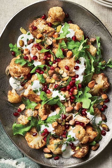 This quick and easy 35-minute cauliflower salad recipe incorporates yogurt sauce and pomegranate seeds to create the ultimate weeknight dinner recipe meets salad recipe.#saladrecipes #wintersalads #wintersaladrecipes #cauliflowerrecipes #sidedishes #sidedishrecipes Pomegranate Recipes Salad, Cauliflower Salad Recipe, Roasted Cauliflower Salad, Zesty Salad, Winter Salad Recipes, Pomegranate Recipes, Pomegranate Salad, Cauliflower Salad, Winter Salad