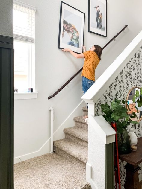 Tips and tricks for hanging photos going up your stairs Photos Up Staircase, Pictures Going Up Staircase, Top Of Stairs Decor Upstairs Landing, Top Of Stairs Decor, Hanging Family Pictures, Pictures On Stairs, Stairway Pictures, Hallways Ideas, Wall Staircase