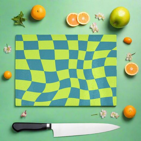 90s style Green colourful check wavy chopping board, the vibrant throwback design will bring a smile to your face while the durable glass surface offers food safe protection for your worktops. This fun piece can protect your surface and can also be used on the table to protect against hot items, its even suitable to serve food on. If you love the 90s and colour this is the board for you. You can shop the matching coasters. High quality, tempered (shatterproof) glass that's hygienic and easy to clean Incredibly durable making it easy to use ever day. Doubles as a serving platter, perfect for gatherings and parties. Made to order in the U.K with high quality materials. Technical Material: Smooth, toughened glass Easy to clean - Dishwasher safe 4 non-slip PVC feet, Hand-printed to order Size: Love The 90s, Coaster Art, Pretty Mugs, Glass Chopping Board, Clean Dishwasher, 90s Style, Serving Food, Small Decor, Chopping Board