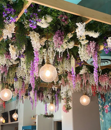 Faux Plant Ceiling Decor, Fake Flower Ceiling, Flower Ceiling Decor, Dried Flower Chandelier, Hanging Flowers From Ceiling, Floral Restaurant, Garden Ceiling, Bacon Brunch, Tropical Garden Party