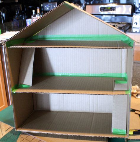 Connecting the roof with frog tape, Cardboard Box Toy Doll House by Little Red Window Dollhouse Plans, Cardboard Box Houses, Diy Cardboard Toys, Cardboard Dollhouse, Diy Barbie House, Cardboard Toys, Cardboard House, Toy House, Barbie Doll House