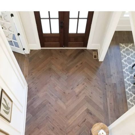 Shannon Homes Design Build on Instagram: "Way to make an entrance! Love how this herringbone foyer floor turned out! 😍 [#eloiseandparo #interiordesigner #interiordesign #residentialdesign #homedecor #homedesignideas #designinspo #herringbone #hardwoodfloors #details #freshclassic #notboring #interiorstylist #interiordesignideas #newconstruction #millwork #naturallight #foyerdecor #frontdoor #pattern ]" Entry Tile Floor Entryway Herringbone, Herringbone Wood Floor Foyer Entryway, Herringbone Tile Floor Entryway, Herringbone Wood Floor Entryway, Herringbone Foyer, Chevron Entryway, Lvp Herringbone, Foyer Flooring Ideas Entryway, Herringbone Wood Tile Floor