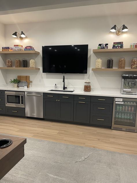 Bar With Floating Shelves And Tv, Home Bar With Tv And Shelves, Wet Bar Designs With Tv, Bar Wall With Tv, Basement Bar With Tv In Middle, Small Basement Tv Room, Built In Bar With Tv, Bar With Tv In Middle, Basement Bar Tv