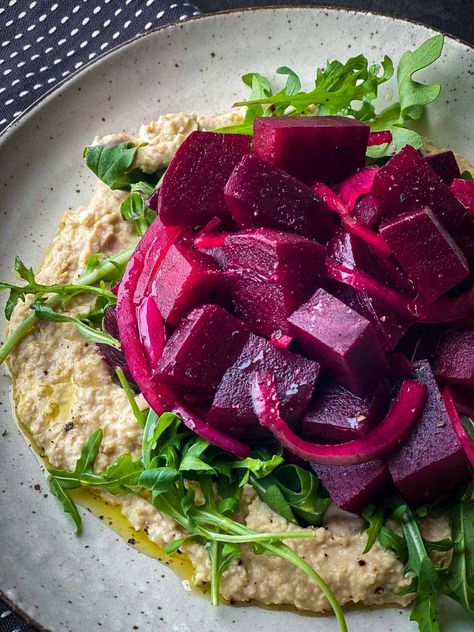 Contrasting pickled beet salad with a lemony chickpea mash, the combination delivers zest and comfort in one bite. Perfect for a light lunch or to share with your friends. Pickled Beets Salad, Pickled Beet Salad, Beets Salad, Chickpea Mash, Beetroot Carpaccio, Creamy Chickpea, Beetroot Recipes, Satisfying Salads, Veggie Snacks