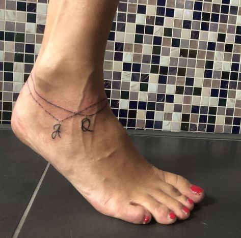 Anklet tattoo with letters | Anklet tattoos, Bracelet tattoos with names, Ankle bracelet tattoo Beach Anklet Tattoo, Tattoo With Letters, Unique Tattoos For Moms With Kids, Charm Anklet Tattoo, Heel Tattoo, Bracelet Tattoos With Names, Ankle Tats, Anklet Tattoos For Women, Anklet Tattoo