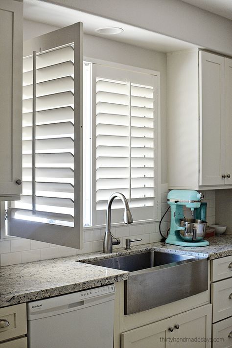 Shutters on window over kitchen sink with one panel open Kitchen Window Treatments Ideas, Window Shutters Indoor, Shutters Indoor, Kitchen Shutters, Window Treatments Ideas, White Shutters, Interior Window Shutters, Kitchen Window Curtains, Custom Window Coverings