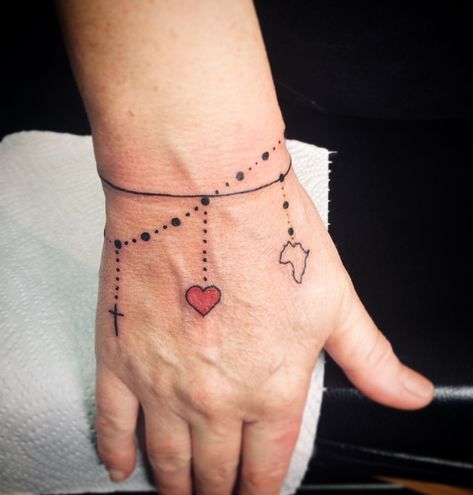 Doug Moolman on Instagram: “Dainty little bracelet for Nerina this morning 🌼 #bracelettattoo #charmbracelettattoo #wristtattoo #delicatetattoo #spektraxion…” Bracelet Tattoo Ideas, Charm Bracelet Tattoo, Wrist Bracelet Tattoo, Charm Tattoo, Sister Tattoo Designs, Bracelet With Cross, Chain Tattoo, Ankle Bracelet Tattoo, Bracelet Tattoo