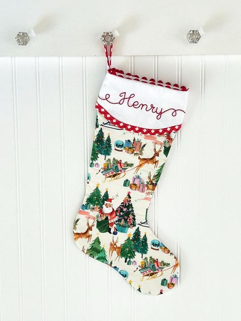 Our beautifully quilted Christmas stockings measure 20" diagonally from bottom of loop to tippy toe. Order with or without a matching red gingham bow. Our signature ric rac trim, custom hand embroidered name, red gingham trim and quilting make this a timeless addition to your Christmas decor. Fully lined with batting and piecing on both sides. You'll love the added surprise of how our cuff overlaps in the back. :: LEAD-TIME :: Please see shipping tab for current lead-time on Christmas stockings. Quilted Christmas Stockings Ideas, Embroidered Stockings Christmas, Quilted Stockings Christmas, Quilt Stocking, Embroidered Christmas Stocking, Quilted Stocking, Traditional Christmas Stockings, Hand Embroidered Name, Unique Christmas Stockings