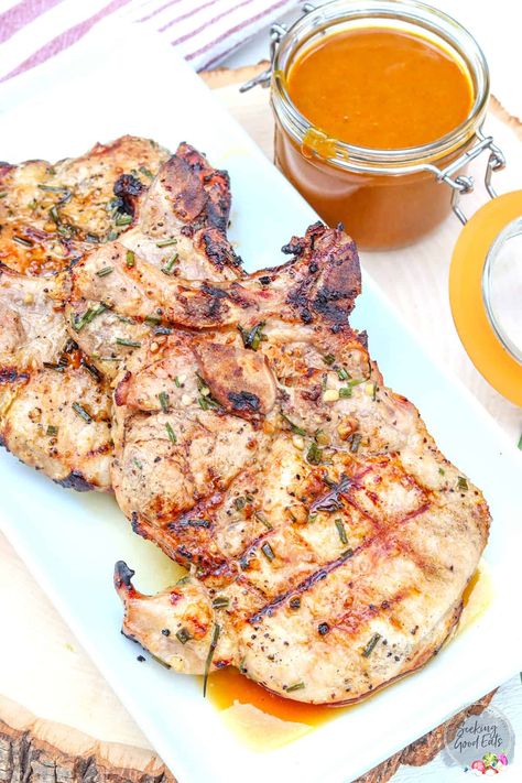 Marinated Pork Chops are juicy and tender with robust flavors like soy sauce, brown sugar, and bourbon. Bake or grill this pork chop recipe! This is sure to be your new favorite marinade recipe - so stinkin' good! Use on any protein including pork, chicken, fish, and beef. Bone In Pork Chop Marinade For Grill, Bone In Pork Chop Marinade, Pork Chops Grilled, Marinated Pork Chops Grilled, Pork Dry Rubs, Slow Cooker Pork Loin, Pork Chop Marinade, Pork Dinners, Marinated Pork Chops