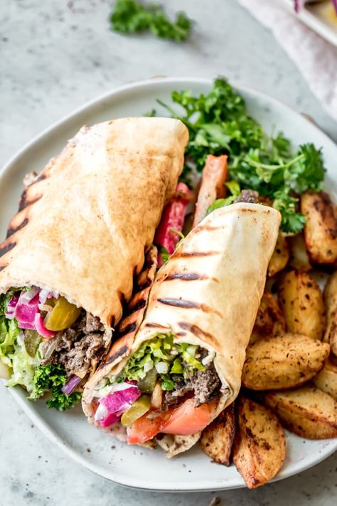 Beef Shawarma is one of the most popular street foods, and especially so in the Middle East. My beef shawarma recipe is an easy one you can make at home. | Middle Eastern Recipes | Wraps | Beef Recipes | #shwarma #beef #wraps #feelgoodfoodie Shwarma Beef, Recipes Wraps, Shawarma Sandwich, Baba Ganush, Beef Kebab, Kebab Wrap, Beef Shawarma, Arabisk Mad, Baked Potato Wedges