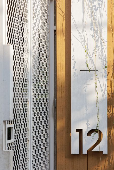 Gallery of Ster House / DELUTION - 23 Entry Door Numbers, House Name Signs Outdoor, House Signage Design, Signage Design Outdoor Entrance, Environmental Graphics Signage, Entrance Signage, Door Signage, House Name Signs, Outdoor Gathering Space