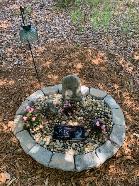 The grave i made up for my sweet cat, Kitty. I like how her lantern glows at night. Cat Memorial Ideas Garden, Dog Gravestone Diy Pet Memorials, Grave For Dogs, Diy Pet Headstone, Dog Grave Ideas Diy, Animal Grave Ideas, Pet Grave Ideas Memorial Gardens, Cat Grave Ideas, Animal Memorial Ideas