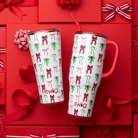 Bigger is better! 😍 Living in your hair-bow era? Festive red and green bows with ivory pearls are the definition of coquette girlycore and Christmas elegance.

Enjoy fewer refills and more time on the move with our biggest bundle ever! Our 40oz Mega Mug and 32oz Tumbler are both comfortable to hold and cup holder friendly, making them the perfect pair for life on the go! Christmas Definition, Mega Mug, Lake Girl, Backpack Lunch Bag, Green Bows, Ivory Pearl, Plastic Straw, Copper Plated, Cocktail Napkins