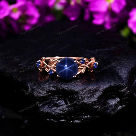 Vintage Star Sapphire Engagement Ring, Branch Leaf Blue Wedding Ring, Nature Inspired Blue Star Sapphire Ring, Rose Gold Ring, Promise Ring JUST OPENED- Experience beautiful jewelry that complements your everyday style, and completes your look. Our jewelry is so stunning, and so you are. Ring description Main Stone: Star Sapphire  ( Lab Created ) Main Stone Size: 5 MM Main Stone Color: Blue  Main Stone Shape: Round Jewelry Type: Engagement Ring Method: Cast Personalization: Possible Occasion: Engagement Ring Size: We make rings from US 4 to US 10. (If you need smaller or bigger ring size, please ask me to resize) Country of Manufacture: India All our work is custom made by hand with Love and Care in our workshop ♥ CUSTOM ORDERS Please let us know if you want any customization or personaliz Star Sapphire Engagement Ring, Blue Star Sapphire Ring, Blue Wedding Rings, Star Sapphire Ring, Make Rings, Blue Star Sapphire, Saphir Ring, Engagement Ring Size, Big Rings