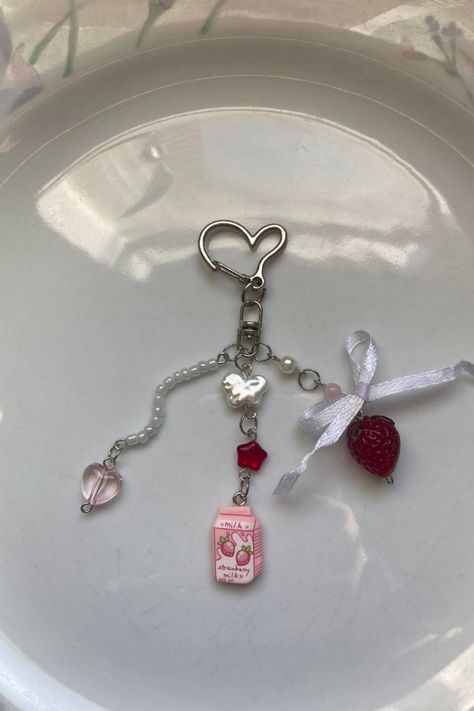 Handmade strawberry bead milk keychain, cute handmade bow keychain, shortcake keyring, handbag strawberry charm silver heart-shaped clasp with a small white bow above the strawberry each keychain is unique made with high-quality glass, lampwork, pearl, and seed beads Milk Keychain, Bow Keychain, Pretty Crafts, Strawberry Charm, Edgy Jewelry, Glass Lampwork, Beaded Keychain, Keychain Cute, Heart Keychain