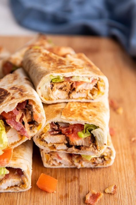 Whether you’re looking for a quick lunch or a craveworthy dinner, this chicken bacon wrap is guaranteed to hit the spot! Melty cheese and a mayo-mustard make it oh-so-satisfying. Chicken Bacon Ranch Wrap Air Fryer, Toasted Chicken Wrap, Chicken Bacon Wraps Tortilla, Crispy Chicken Bacon Ranch Wrap, Bacon Chicken Wrap, Chicken Bacon Ranch Wraps Recipes, Cheese Burger Wraps, Honey Mustard Chicken Wrap, Chicken Bacon Wrap