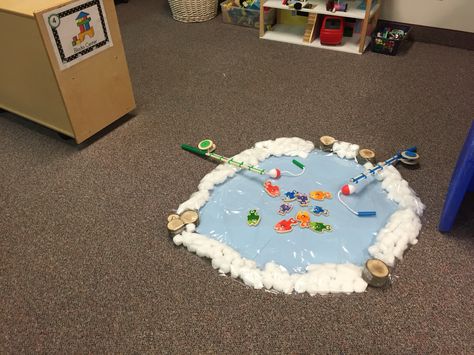 Ice fishing pond for preschoolers Ice Fishing Preschool Activities, Igloo Dramatic Play Preschool, Artic Dramatic Play Area, Ice Fishing Activities For Kids, Ice Fishing Dramatic Play Preschool, Ice Fishing Preschool, Ice Fishing Dramatic Play, Ice Fishing Game, Sensory Artic Animals