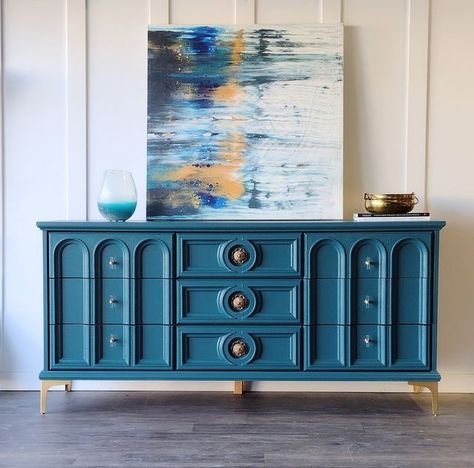 Becky on Instagram: "When I spotted this dresser, I knew those arched drawer panels would be the perfect playground for the teal I'd been dreaming of. I'm so happy with this color-Galapagos Turquoise by Benjamin Moore. The undertones shift beautifully throughout the day as the light is warmer/cooler ; the shade is never garish in bright light or muddy toned in low light. This nine drawer dresser is available. 67 7/8" wide 32 5/8" tall, 18 3/8" deep $700 The coordinating armoire is comin Deep Teal Furniture, Teal Wood Furniture, Silver Bedroom Decor, Turquoise Dresser, Teal Furniture, Teal Dresser, Chest Of Draws, Silver Bedroom, Ocean Hues