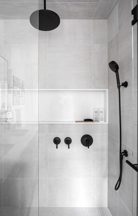 You know how annoying it is to have shampoo and conditioner bottles all over the place in the shower? Well, our favourite way to conquer the mess is to create a shower niche. It's a built-in shelf in the wall of the shower. It keeps everything organized and within easy reach. Plus, it looks really nice. No more knocking over bottles or having to bend down to pick things up. It's such a simple upgrade, but it makes a huge difference in keeping the shower tidy and making the it look better. ... Shower Shampoo Shelf, Shower Niche Shelf, Shower Niche, Shampoo And Conditioner, Really Cool Stuff, Shower, Shelves, Interior Design, Wall