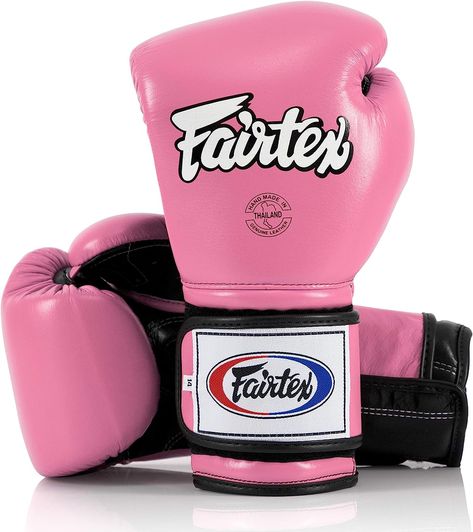 Fairtex boxing glove 2 pair set is ergonomically designed with a unique contoured and tight-fit hand compartment designed to provide a secure and snug fit makes it easy for men & women
The muay thai gloves are constructed of premium leather with Fairtex foam system and pads for excellent hand and knuckle protection & shock disbursement for heavy bags & speed bag
The fairtex muay thai gloves provide all round usage in sports such as kickboxing, MMA, fighting, fitness, training etc. Boxing Gloves Design, Custom Boxing Gloves, Black Boxing Gloves, Pink Boxing Gloves, Muay Thai Gloves, Boxing Mitts, Professional Boxer, Mma Gloves, Heavy Bags