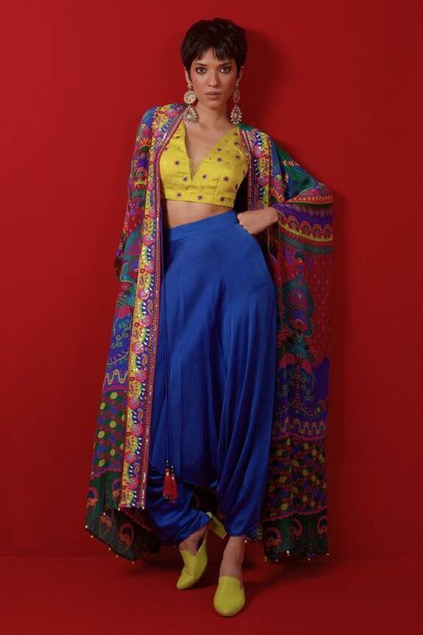 Multicolour floral and geometric print asymmetric cape embellished by ghungroo on hem. Comes with embellished blouse and harem pant. - Aza Fashions Asymmetric Cape, Lehenga Saree Design, Desi Wear, Moroccan Fashion, Desi Fashion Casual, Harem Pant, Color Blouse, Multi Color Blouse, Bridal Dress Fashion