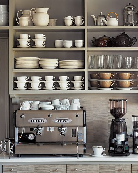 Everything Martha needs for a perfect cup of coffee or tea is all in one place: The espresso machine is on the counter; assorted cups, French presses, and teapots are on the shelves above; and everyday flatware and teas are in the drawers below. #marthastewart #kitchentips Kaffe Station, Martha Stewart Kitchen, Coin Café, Café Design, Diy Coffee Bar, Coffee Bar Design, Bar In Casa, Home Coffee Stations, Kabinet Dapur