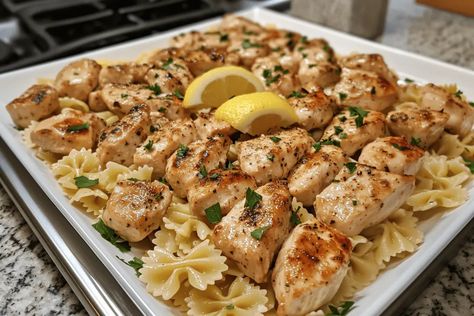 Savor Lemon Garlic Chicken Bites with Creamy Bowtie Pasta—a delicious, easy recipe perfect for family dinners. Ready in just 30 minutes! Lemon Chicken Bowtie Pasta, Lemon Garlic Chicken Bites With Creamy Bowtie Pasta, Lemon Garlic Chicken With Bow Tie Pasta, Lemon Garlic Chicken With Creamy Bowtie Pasta, Chicken And Bowtie Pasta Recipes, Creamy Bowtie Pasta, Lemon Garlic Chicken Pasta, Creamy Lemon Chicken Pasta, Chicken Bowtie Pasta