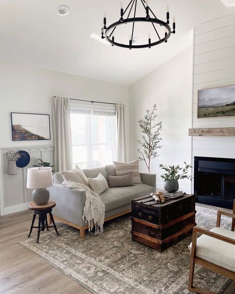 Black Wood And Grey Living Room, Wood And Grey Living Room, California Modern Living Room, Wood And White Table, White Living Room Chairs, Black Wagon Wheel Chandelier, Grey Sectional Couch, Shiplap Living Room, Tufted Ottoman Coffee Table