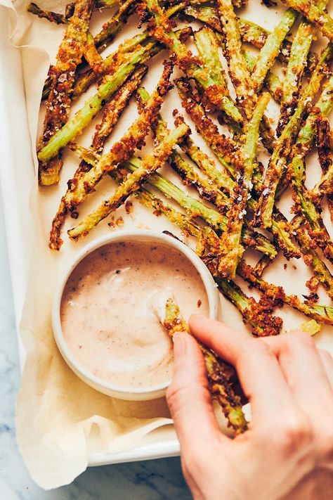 Hand dipping broccoli fry into a bowl of vegan dijon aioli Broccoli Stems Air Fryer, Fried Broccoli Stems, Brocolli Stalk Recipe, Broccoli Stalk Fries, Brocolli Stems Recipe, Broccoli Fries Recipe, Broccoli Fries Air Fryer, Broccoli Stem Fries, Broccoli Stalk Recipes