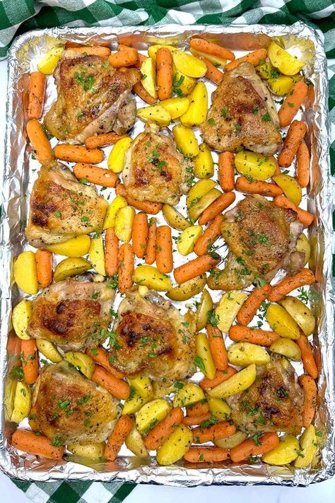 Craving an easy weeknight dinner that's packed with flavor? Look no further than Simple Sheet Pan Ranch Chicken with Potatoes and Carrots! This one-pan wonder is a dream come true for busy home cooks. Tender, juicy chicken roasts alongside crispy potatoes and sweet carrots, all coated in a crave-worthy ranch seasoning. Best part? Minimal prep and cleanup make this recipe a win-win. Get ready for a delicious and satisfying meal that the whole family will love. Sheet Pan Chicken Potatoes Carrots, Roasted Chicken With Potato And Carrots, Carrots Potatoes And Chicken, Chicken And Roasted Carrots, Chicken Carrots Recipe, Chicken With Potatoes And Carrots, Chicken Potatoes Carrots, Ranch Chicken Thighs, Chicken Thighs With Potatoes