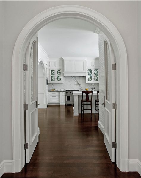 Caden Design Group. Kitchen Ideas. Custom doors that take shape of the arch create a beautiful entrance into a pristine kitchen. #Kitchen Kitchen Entryway Ideas, Kitchen Arch, Arch Kitchen, Modern Family Room Design, Archways In Homes, Kitchen Design Images, Kitchen Entrance, Modern Family Rooms, Home Bunch