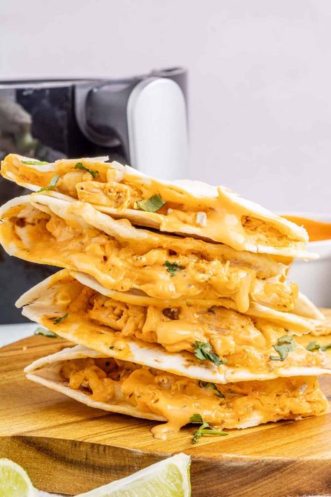 Craving something delicious and easy? Try these Air Fryer Buffalo Chicken Quesadillas! They're quick to make and packed with flavor, with shredded chicken, tangy buffalo sauce, and creamy ranch dressing all wrapped up in a tortilla and air-fried to perfection. Air Fryer Chicken Tortilla Wraps, Buffalo Chicken Pita Pocket, Air Fryer Chicken Wraps, Chicken Tortilla Wraps, Chicken Pita Pockets, Buffalo Chicken Pinwheels, Chicken Fajita Wraps, Air Fryer Buffalo Chicken, Buffalo Chicken Fries