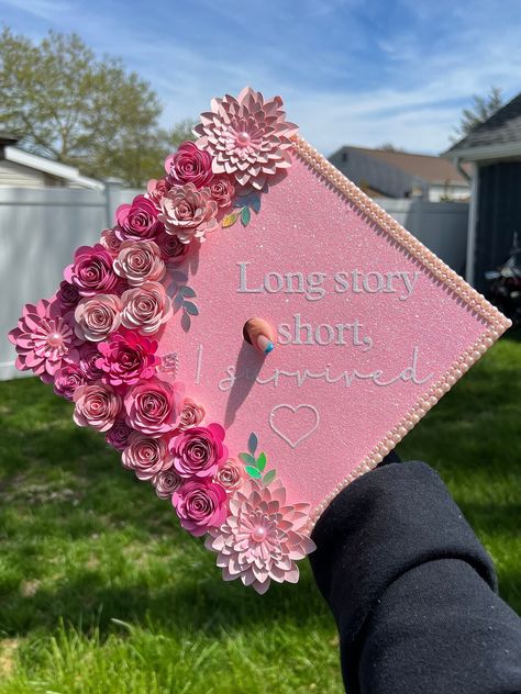 Personalized graduation cap topper, pink shades, silver, pearls, quote "Long story short, I survived". Let your personality shine✨ Cute Girly Graduation Cap, Lpn Cap Decoration Graduation, Grad Topper Ideas, Graduation Cap Mom, White Graduation Cap Designs, Unique Graduation Cap Designs College, Red Graduation Cap Designs, Graduation Cap Designs Cute, Associates Degree Graduation Cap