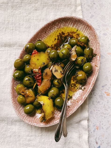 Our Chef in Residence's Warm Olives are the perfect savory bite when you just feel like grazing, and the ultimate addition to any cheese board. Warm Olives, Castelvetrano Olives, Lemon Juice Benefits, Hot Lemon Water, Lemon Water Benefits, Bath Recipes, Lemon Olive Oil, Fresh Oregano, Turmeric Benefits