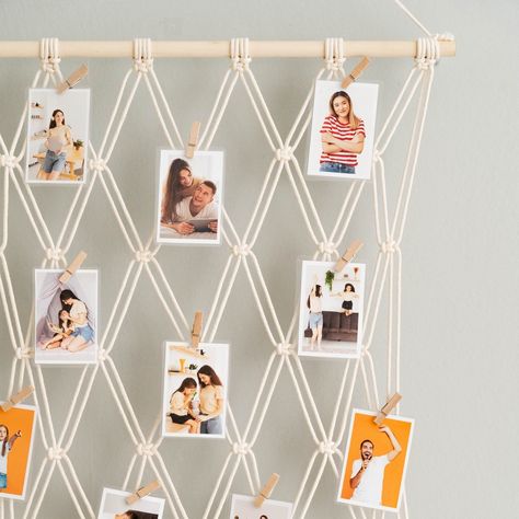 Our Macrame Photo Display is the ultimate upgrade for your wall. Forget boring picture frames – this handcrafted piece turns your favorite photos into the stars of the show. Explore more at https://beandaikon.etsy.com/listing/1731415064 or get in touch with us directly #bohogifts #handcraftedart #bohohomes #wallhangingart #macramewallhanging #macramestyle #handmadehomegoods #homegift #macramehandmade #macramedecoration #lovemacrame #bohowallhanging #homedecoration #decorateyourhome #handma... Boring Pictures, Vacation Memories, Picture Holders, Boho Wall Hanging, Handcrafted Art, Picture Hangers, Photo Display, Boho Gifts, Bedroom Storage