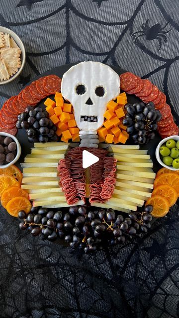 Ain’t Too Proud To Meg on Instagram: "SAVE this post & follow @ainttooproudtomeg for more. Comment CHEESE & I’ll DM you the full instructions to this CHARCUTERIE SKELETON so you can have it ready for #halloween.     INGREDIENTS  * 13 oz brie  * 2 oz blueberry jam  * 4 yogurt covered pretzels  * string cheese * 16 oz young manchego, sliced evenly lengthwise & height wise into triangles * 12 oz @columbusmeats Italian Dry Salame  * @columbusmeats Charcuterie Tasting Board (I used the Calabrese Salame, Castelvetrano olives & chocolate covered cranberries from here) * 10 oz mild cheddar, cubed  * 30 oz dark purple grapes  * 8 dried orange slices     INSTRUCTIONS  1. Place brie in the freezer for 15-20 minutes to allow for easier cutting.  2. For the brie skull, cut wedges out of the sides of th Skull Brie Cheese, Skeleton Brie Cheese, Charcuterie Skeleton, Halloween Charcuterie Board Ideas, Tasting Board, Castelvetrano Olives, Halloween Finger Foods, Yogurt Covered Pretzels, Charcuterie Board Meats