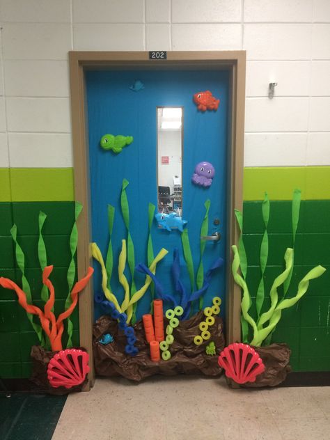 Under the Sea classroom door with pool noodles and dollar tree beach toys. Under The Water Theme Classroom, Under Sea Classroom Theme, Under The Sea Preschool Classroom, Water Theme Classroom Decor, Sea Animal Decorations, Sea Themed Decorations, Under The Sea Classroom Decorations, Under The Sea Classroom Activities, Under The Sea Preschool Theme