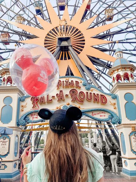 A girl stands with a Mickey ballon, Mickey ears, with her back turned away from the camera. She stands in front of the entrance to Pixar pier, which has the words “Pixar Pal-A-Round” Disney Land Pictures, Disney Poses, Pixar Pier, Disneyland Photography, Adventure Picture, Aesthetic Disney, Disneyland Planning, Disneyland California Adventure, Disneyland Photos