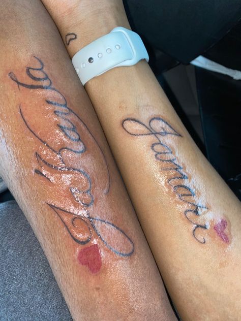 Boyfriend Gets Girlfriend Name Tatted, Name Tattoos For Girlfriend, Tattoo Ideas For Boyfriend And Girlfriend, Tattoo Ideas Boyfriend Girlfriend, Matching Name Tattoos Couples, Tattoo Girlfriend Name, Matching Couple Tattoos Black People, Girlfriends Name Tattoo Ideas, Matching Name Tattoos