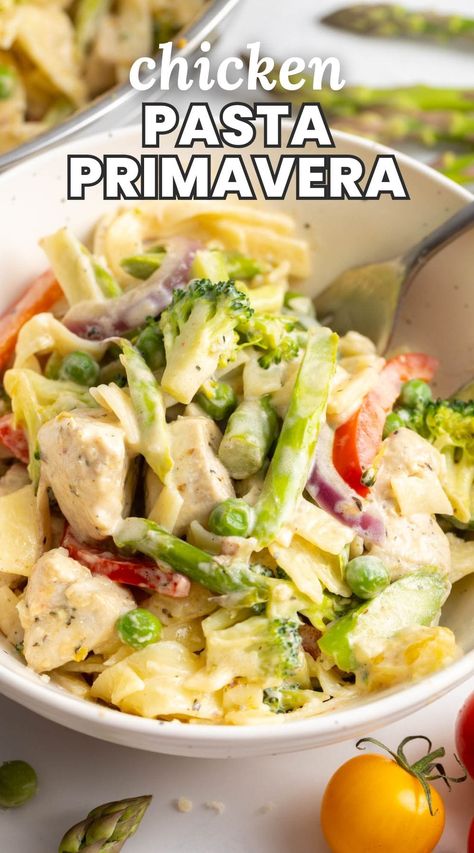 Chicken Pasta Primavera is a 30 minute meal packed with fresh vegetables, juicy chicken, and pasta in delectable parmesan cream sauce. Pasta Primavera Recipes With Chicken, Creamy Chicken Pasta Primavera, Pasta With Veggies And Chicken, Chicken Alfredo Primavera, Creamy Chicken Primavera, Chicken And Vegetable Pasta Recipes, Chicken Primavera Pasta Creamy, Creamy Chicken And Vegetables, Creamy Pasta Primavera Recipes