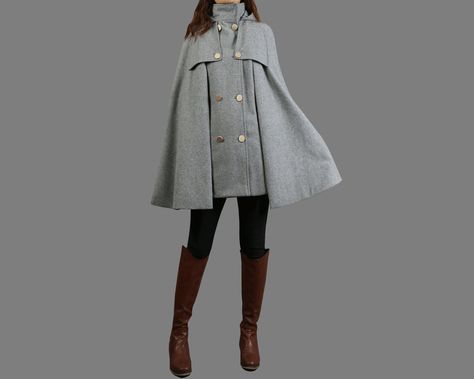 * A cool and long wool cape coat with hood, very elegant. * With double row gold color buttons and two pockets, fully lined. * If you want black buttons, please let us know, thanks. * Stand up collar, more warmer. * Material: out shell - 50% wool, 50% polyester; lining - 100% polyester * Care: dry cleanable * Shop sizing chart FYI ( made according to US sizing. actual body figures, not laying flat clothes measurements) Size XS (US 2, UK 6, German 32, French 34, ) Bust: fits bust around 33.5 inch Magic Universe, High Neck Coat, Mantel Cape, Wool Cloak, Belle Outfit, Wool Cape Coat, Shawl Winter, Cape Fashion, Cloak Coat