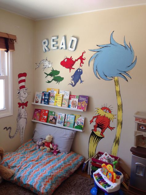 Dr. Seuss wall mural painting reading corner for kids Cat in the Hat One Fish Two Fish Red Fish Blue Fish The Lorax Dr Suess Nursery, Dr. Suess, Dr Seuss Nursery, Baby Room Shelves, The Cat In The Hat, Adorable Nursery, Nursery Mural, Award Ceremony, Room Shelves